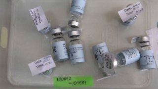 In this Feb. 18, 2021, file photo, empty vials that contained a dose of the Johnson & Johnson vaccine against the COVID-19 coronavirus lie on a table as South Africa proceeds with its inoculation campaign at the Klerksdorp Hospital.