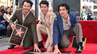 The Jonas Brothers with their Walk of Fame star.