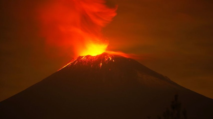 Incandescent materials, ash and smoke are spewed from the Popocatepetl volcano as seen from the San Nicolas de los Ranchos community, state of Puebla, Mexico, on May 23, 2023. Mexican authorities on May 21 raised the warning level for the Popocatepetl volcano to one step below red alert, as smoke, ash and molten rock spewed into the sky posing risks to aviation and far-flung communities below. Sunday’s increased alert level — to “yellow phase three” — comes a day after two Mexico City airports temporarily halted operations due to falling ash. (Photo by Rafael Duran / AFP) (Photo by RAFAEL DURAN/AFP via Getty Images)