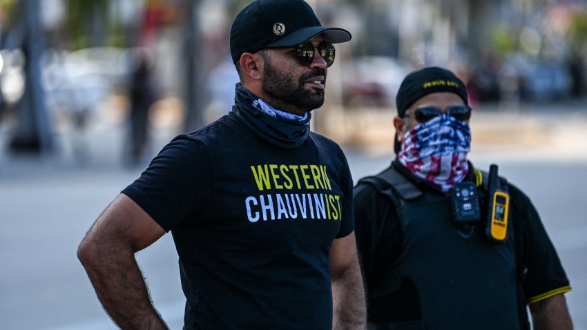 Chairman of the Proud Boys Enrique Tarrio (L), wearing a shirt supporting Derek Chauvin, looks on while counter-protesting near the Torch of Friendship, where people gathered to remember George Floyd on the one-year anniversary of his death at the hands of a police officer, in Miami on May 25, 2021. – The family of African American George Floyd appealed today for sweeping police reform on the anniversary of his murder by a white officer as they met President Joe Biden at the White House. The legislation being considered to increase police accountability would be named after Floyd, who suffocated after being pinned down under the knee of Minneapolis officer Derek Chauvin on May 25, 2020.
 – (Photo by CHANDAN KHANNA / AFP) (Photo by CHANDAN KHANNA/AFP via Getty Images)