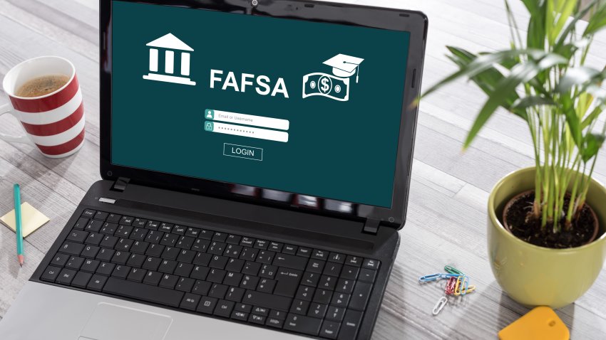 Laptop on a desk with fafsa concept on the screen