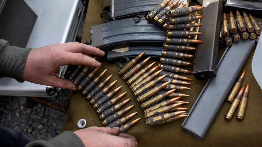 Gun rights advocates practice firing machine guns at a gun range during the Rod of Iron Freedom Festival, a pro-gun far right gathering organized by Sean Moon of the Unification Church, October 8, 2022, in Greely, Pennsylvania.