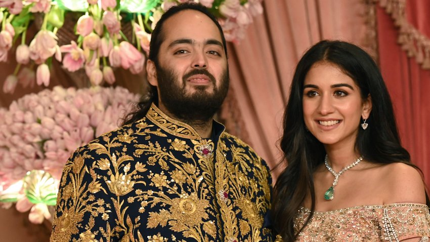 Anant Ambani son of billionaire tycoon and Chairman of Reliance Industries Mukesh Ambani (unseen) with his fiancee Radhika Merchant pose for a picture during their Sangeet Ceremony in Mumbai, on July 5, 2024. (Photo by SUJIT JAISWAL / AFP) (Photo by SUJIT JAISWAL/AFP via Getty Images)