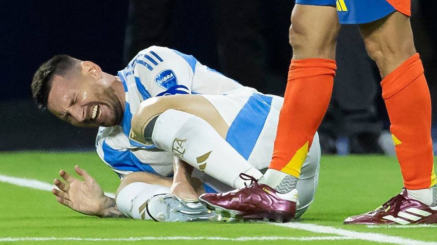 Argentina forward Lionel Messi (10) reacts after hurting his right ankle on a play against Colombia in the first half of their Copa America 2024 Final soccer match at Hard Rock Stadium on Sunday, July 14, 2024, in Miami Gardens, Florida. (Matias J. Ocner/Miami Herald/Tribune News Service via Getty Images)