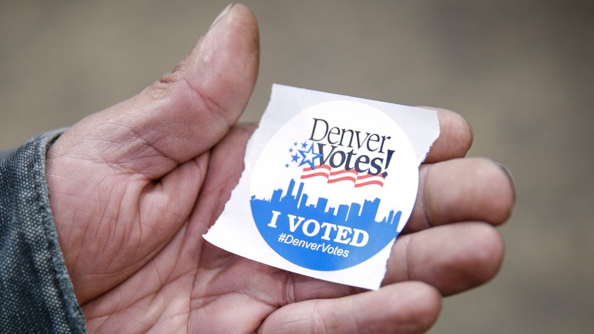 DENVER, CO – NOVEMBER 08: Charles Dominguez of Denver, Colorado grabs an “I Voted” sticker after casting his ballot at the Denver Elections Division offices on November 8, 2016 in Denver, Colorado. After a contentious campaign season, Americans go to the polls today to choose the next president of the United States. (Photo by Marc Piscotty/Getty Images)