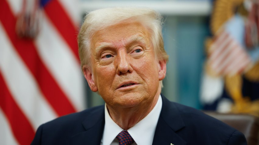 File.  President Donald Trump signs executive orders in the Oval Office on January 20, 2025 in Washington, DC.  Trump takes office for his second term as the 47th president of the United States.