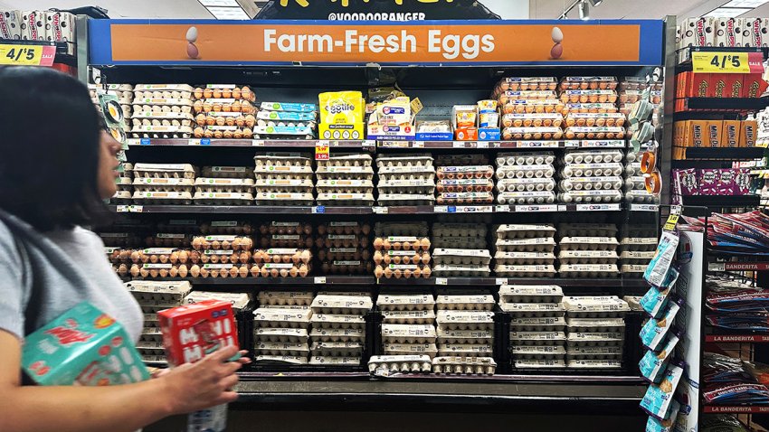 A supermarket shopper walks past a display of eggs for sale on February 10, 2025 in Monterey Park, California. A resurgence of avian flu, which first struck the United States in 2022, is hitting chicken farms hard, sending egg prices soaring and rattling consumers accustomed to buying this dietary staple for only a few dollars. (Photo by Frederic J. BROWN / AFP) (Photo by FREDERIC J. BROWN/AFP via Getty Images)
