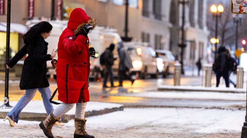 People walk amid cold wind in Chicago, the United States, on Feb. 12, 2025. Chicago is bracing for its first major winter storm of the season as moderate to heavy snow blanketed the U.S. third largest metropolitan city Wednesday.   More than 100 schools in Chicago closed. A ground delay went into effect at the Chicago O’Hare International Airport beginning 12 p.m. An alert from the Federal Aviation Administration said departures to airport are delayed an average of 90 minutes due to snow and ice. (Photo by Vincent D. Johnson/Xinhua via Getty Images)