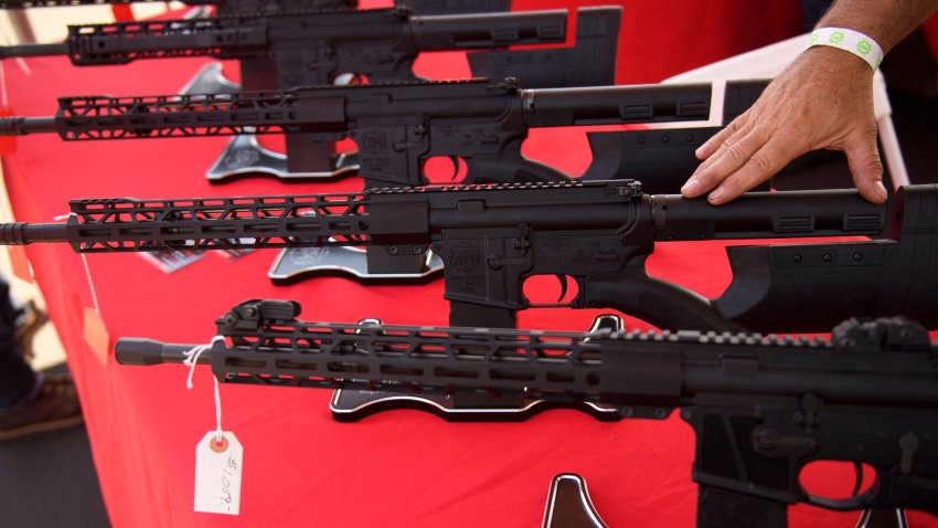 A TPM Arms LLC California-legal featureless AR-15 style rifle is displayed for sale at the company’s booth at the Crossroads of the West Gun Show at the Orange County Fairgrounds on June 5, 2021 in Costa Mesa, California. – Gun sales increased in the US following Covid-19 pandemic lockdowns. On June 4, a San Diego federal court judge overturned California’s three-decade old ban on assault weapons, defined as a semiautomatic rifle or pistol with a detachable magazine and certain features, but granted a 30-day stay for a State appeal and likely future court decisions on the constitutionality of the ban under the Second Amendment. An industry of California legal “featureless” or “compliant” AR-15 style rifles developed for California consumers, adapting to the law with design changes to the popular rifle. (Photo by Patrick T. FALLON / AFP) (Photo by PATRICK T. FALLON/AFP via Getty Images)