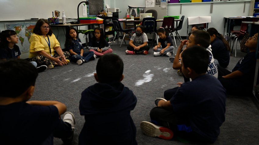 DENVER, COLORADO – AUGUST 24: Students in Denise Saizs third-grade classroom gather on the floor for a morning lesson at Castro Elementary, a small bilingual school in the Denver Public School system, on August 24, 2022 in Denver, Colorado.(Photo by RJ Sangosti/MediaNews Group/The Denver Post via Getty Images)