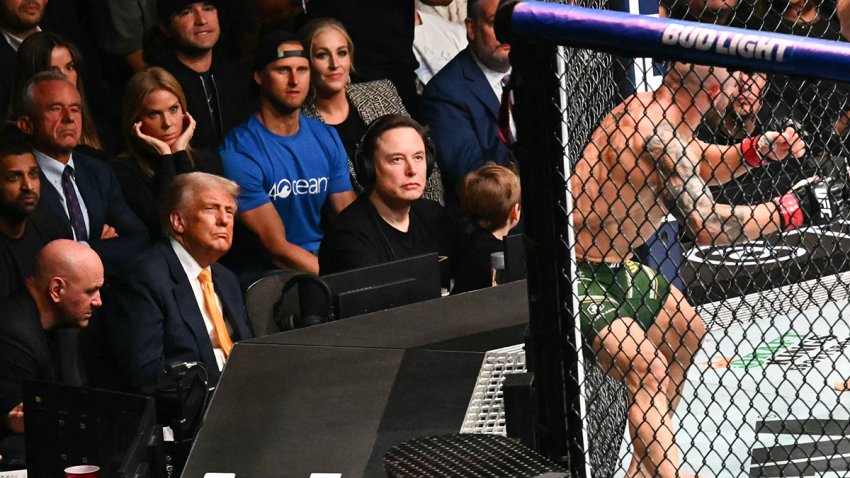 US actress Cheryl Hines plugs her ears as she sits with her husband US Secretary of Health and Human Services Robert F. Kennedy Jr., US President Donald Trump with Elon Musk and his son X Æ A-12 watching the featherweight fight between Australian fighter Alexander Volkanovski and Brazilian fighter Diego Lopes (off frame) during UFC 314 at the Kaseya Center in Miami, Florida, in the early hours of April 13, 2025. (Photo by Mandel NGAN / AFP) (Photo by MANDEL NGAN/AFP via Getty Images)