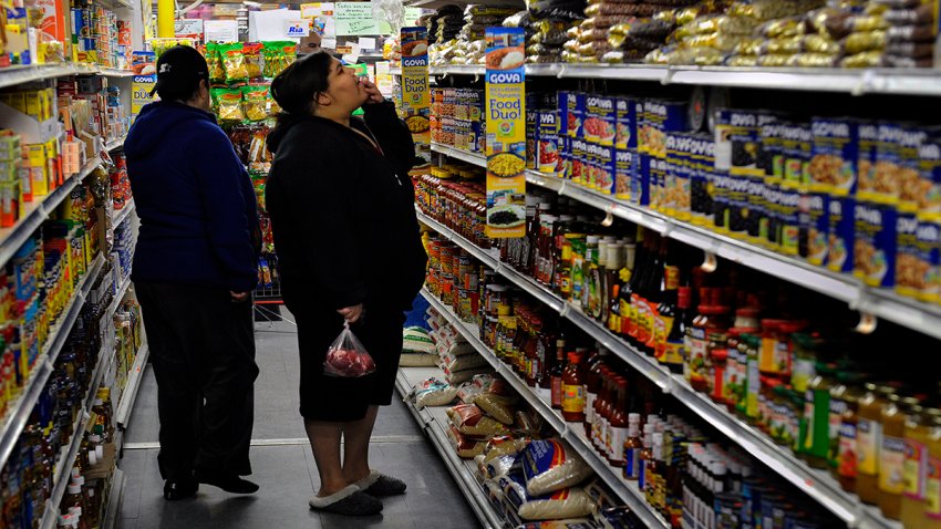 WOONSOCKET, RI – MARCH 01: Mily Cintron eyes some beans at International Market just after she bought some pork for $5.89 (in her hand). She’s looking for deals because she says her SNAP (food stamps) card is usually empty by the end of the month. Many families and individuals in Woonsocket, Rhode Island are needy and take part in the SNAP (food stamps) program. Photo by Michael S. Williamson/The Washington Post via Getty Images