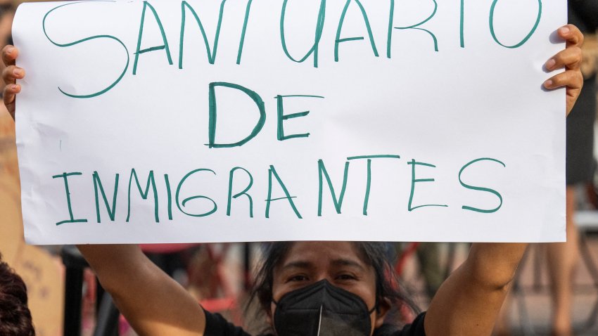 A woman holds a sign reading “Santuario de Inmigrantes” (Immigrant Sanctuary) as protestors demonstrate to protect the District of Columbia as a sanctuary city, in Washington, DC, on April 4, 2025. Protesters are calling for greater protection of migrants in the city and urging local authorities to uphold a law that limits collaboration between city agencies, local law enforcement, and US Immigration and Customs Enforcement (ICE). This measure, passed by the DC Council during President Trump’s first term, has solidified D.C.’s designation as a sanctuary city. Recently, the District government removed a webpage that had previously highlighted DC’s status as a “sanctuary city.” (Photo by ROBERTO SCHMIDT / AFP) (Photo by ROBERTO SCHMIDT/AFP via Getty Images)