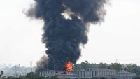 Smoke billows from a fire in a building in Herzliya near Tel Aviv following a fresh barrage of Iranian rockets on June 17, 2025. Israel’s military said air raid sirens sounded in several areas of the country on June 17 after identifying missiles launched from Iran, as AFP journalists reported booms over Tel Aviv and Jerusalem.