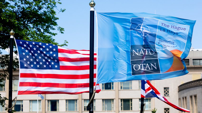 A US and a NATO flag flutter in the wind ahead of a NATO summit in The Hague, on June 23, 2025. Netherlands hosts a NATO summit on June 24 and 25, 2025. (Photo by Iris van den Broek / ANP / AFP) / Netherlands OUT (Photo by IRIS VAN DEN BROEK/ANP/AFP via Getty Images)