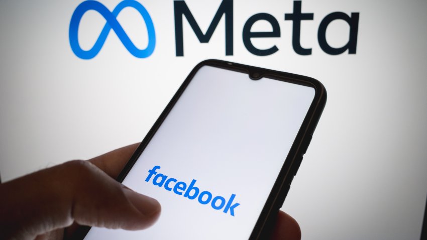 The Facebook logo appears on a smartphone screen, and the Meta logo serves as the background on a laptop screen in this photo illustration in Athens, Greece, on July 18, 2025. (Photo by Nikolas Kokovlis/NurPhoto via Getty Images)